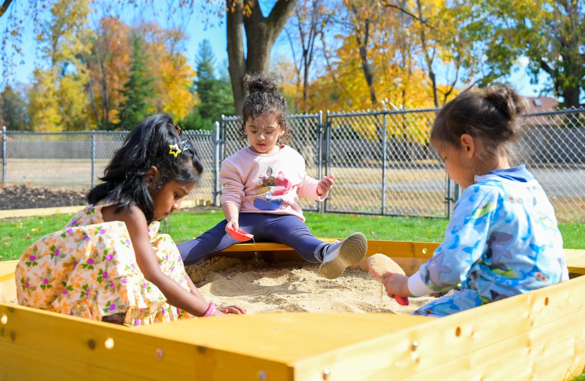 Two children collaborating on a Montessori classroom activity