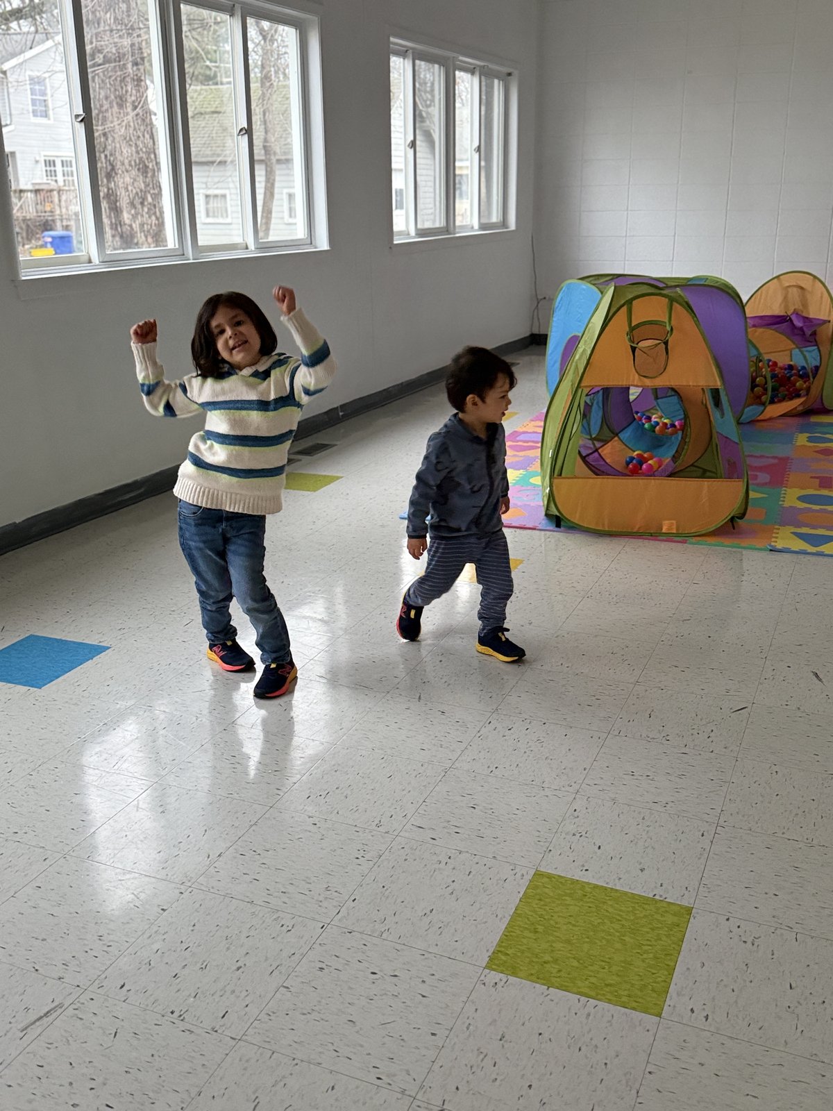 Child practicing fine motor skills with Montessori materials