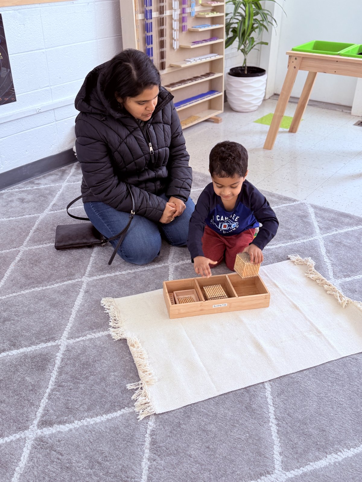 Child engaged in sensory exploration with natural materials