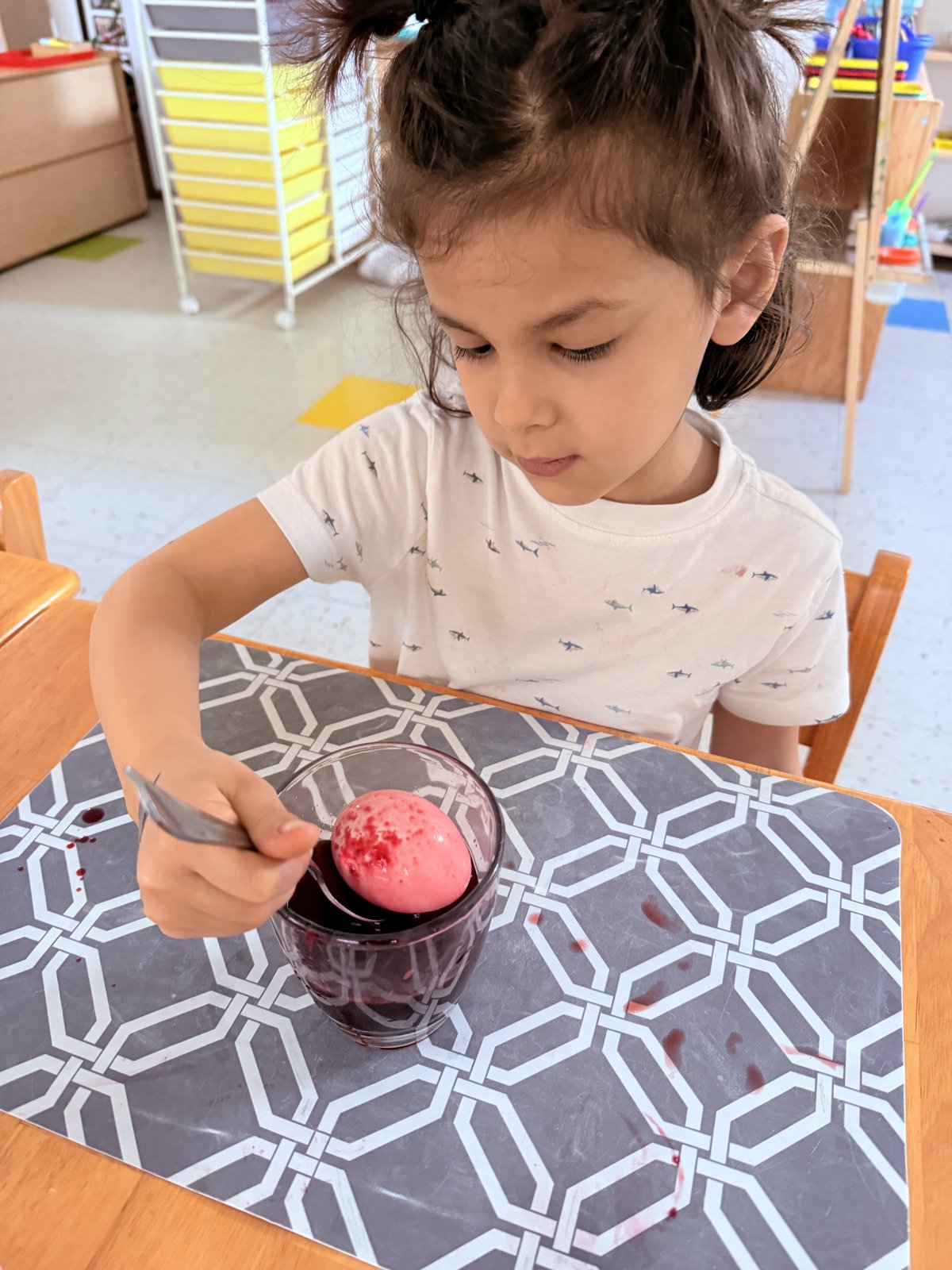 Child creating a masterpiece with watercolors and brushes